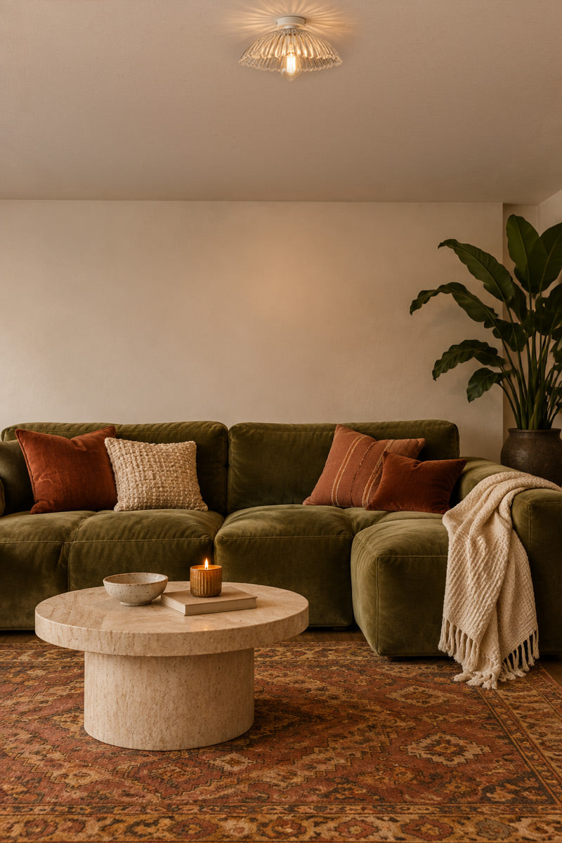 low ceiling living room with green velet couch and flush mount light ideal with glass shade for better illumination