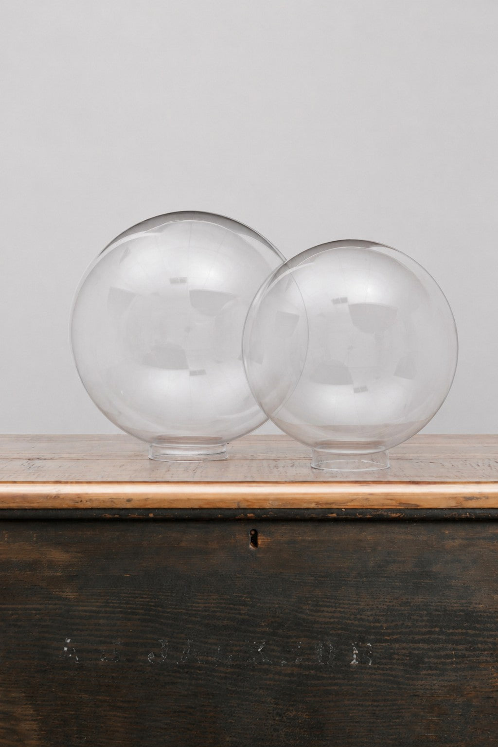 Medium and large clear glass ball shades. 