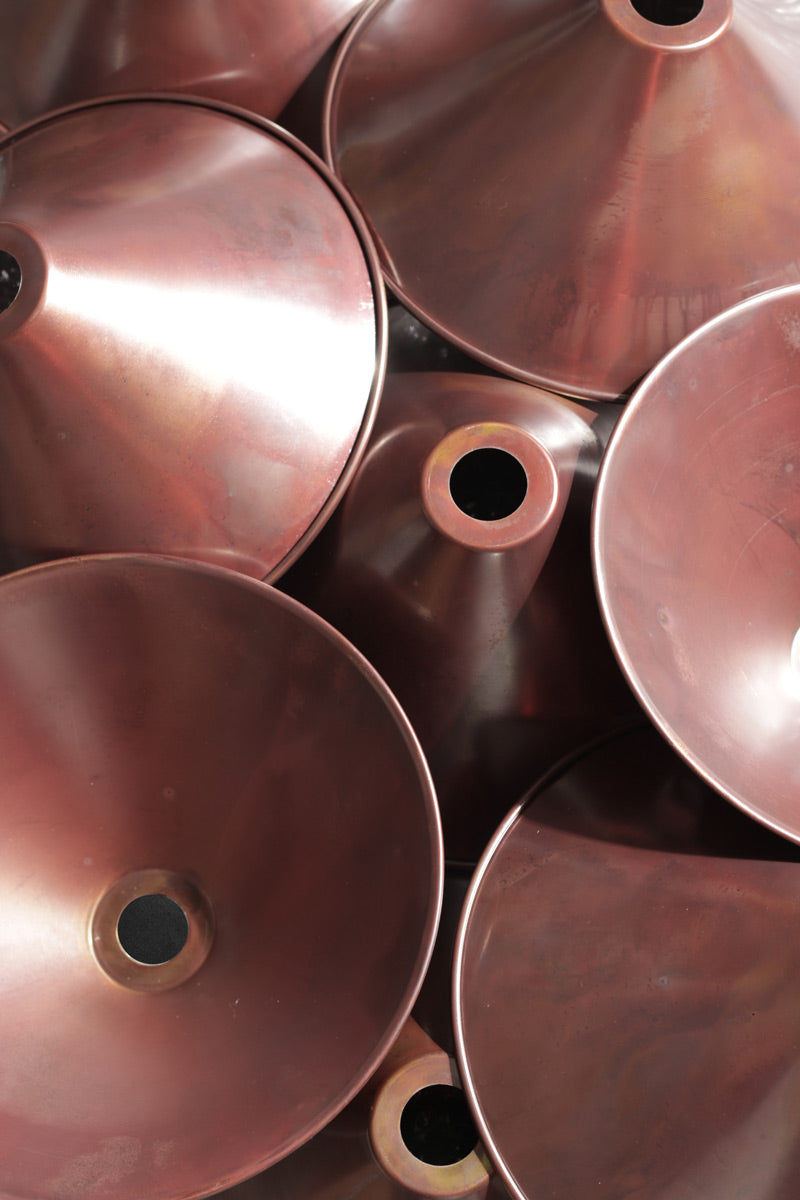 Aged copper cone shades. 