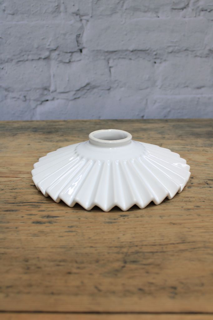 Glazed white ceramic shad with pleated detailing. 