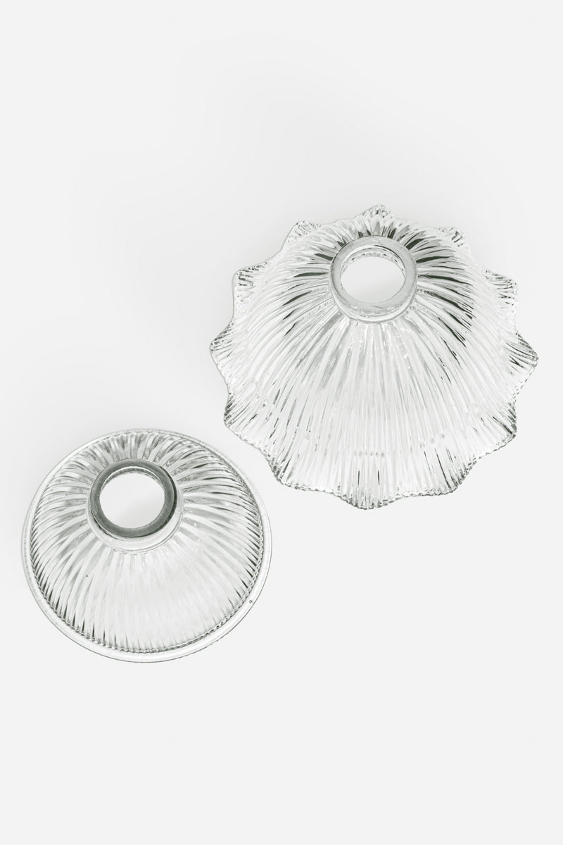 Top view of the Holophane clear glass shades, one in a large size with a frilled edge, the second in a small size with a plain edge. 