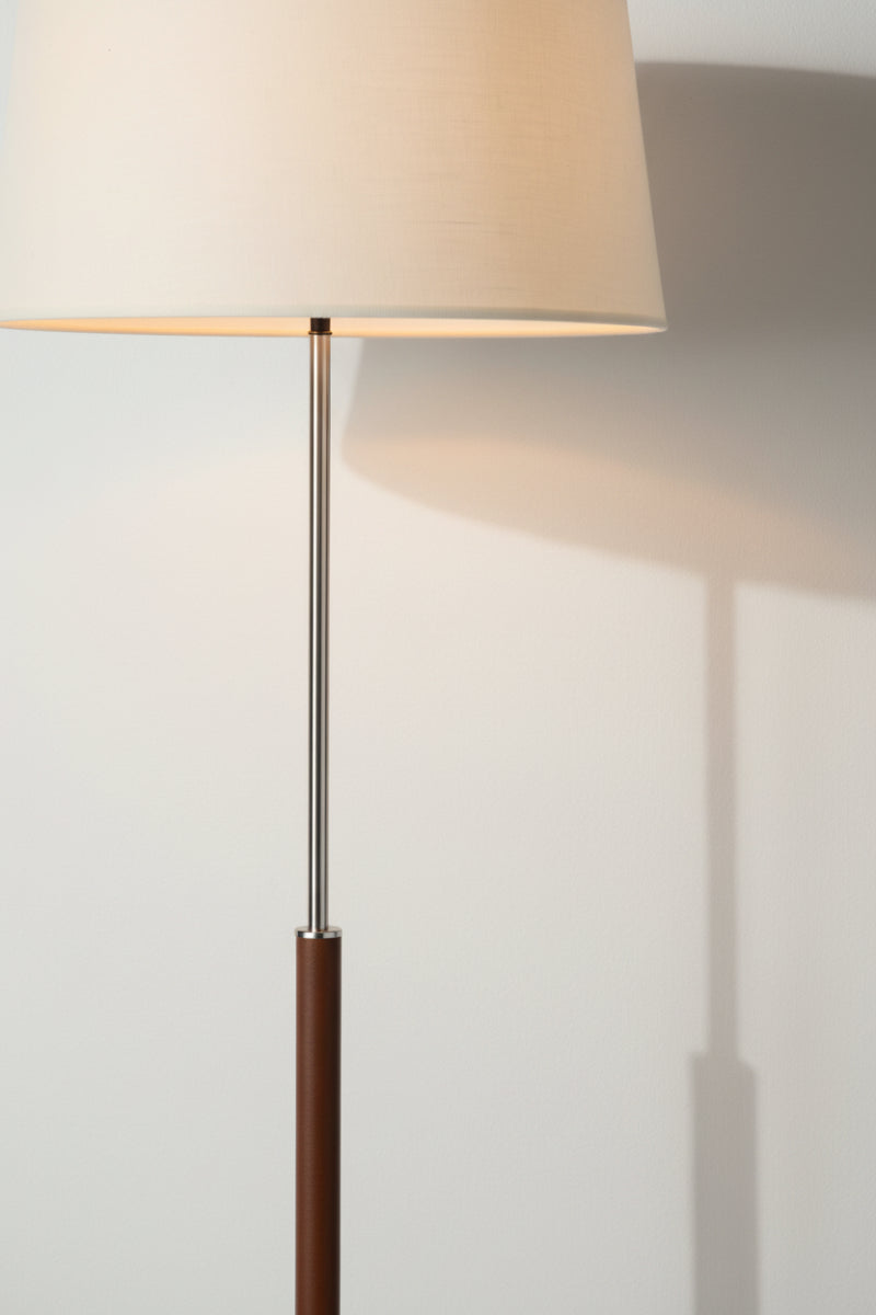 Close up of the satin chrome, brown leather stem and cream linen shade. 