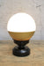 Crown Sphere Lamp with a black lamp holder, black gallery and a gold and opal shade