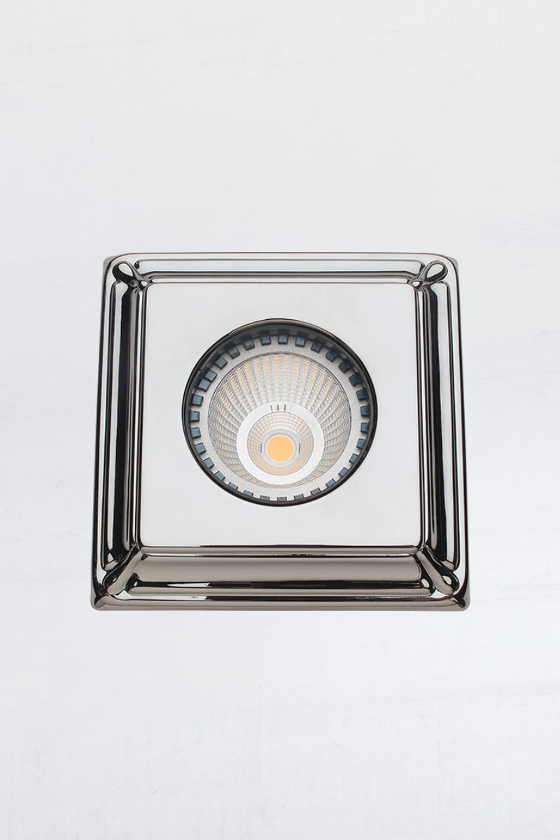 Bright chrome square press brass downlight cover and LED downlight driver. 