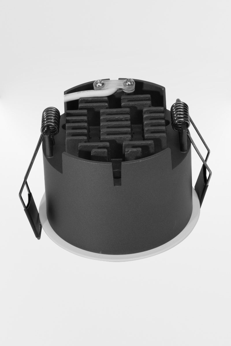 Grey body of the Pinhole 6W LED downlight with white face . 