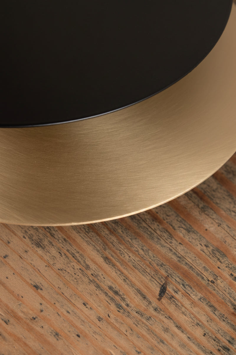 Black and brass metal discs