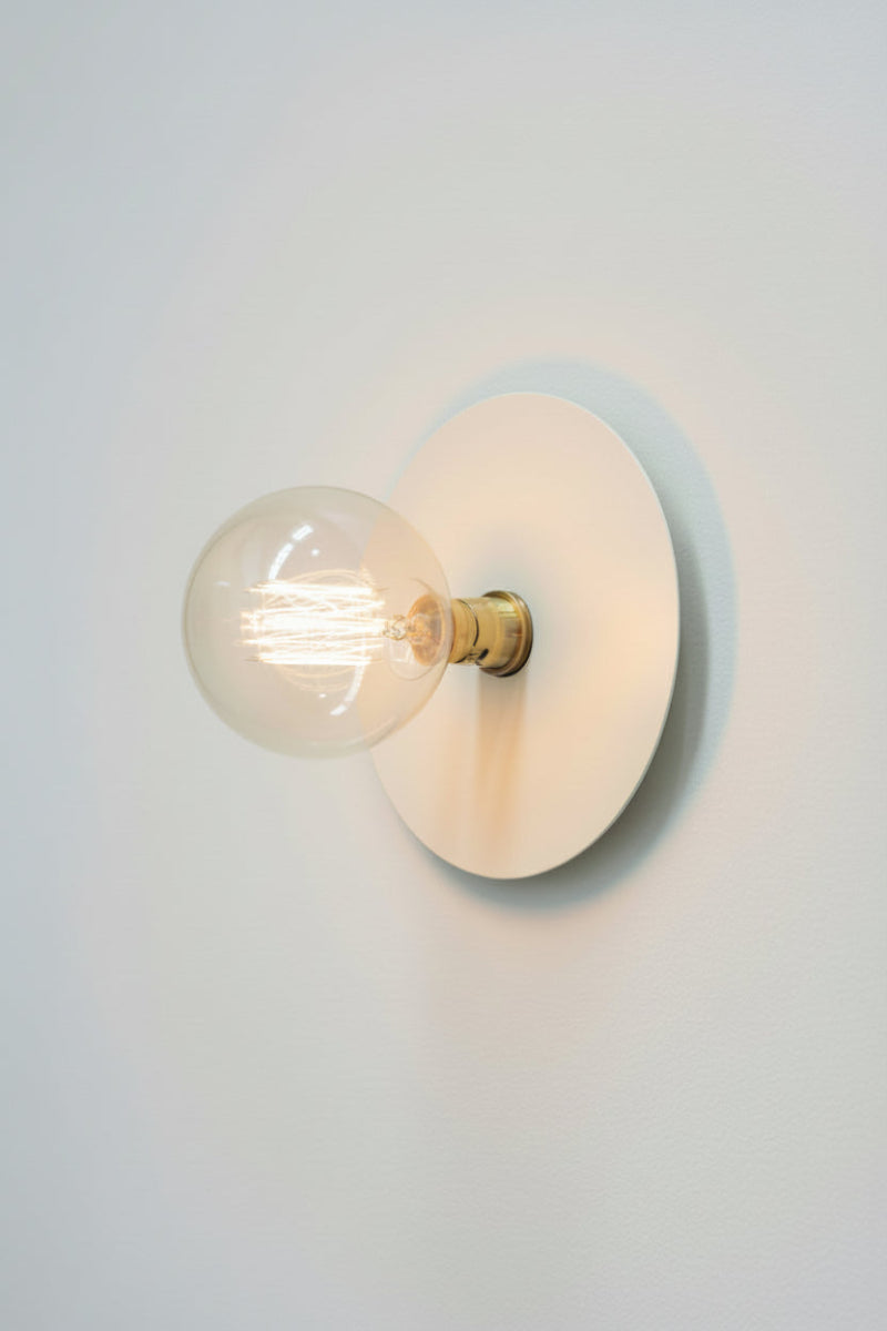 Small white disc wall light