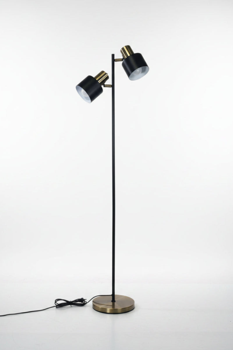 Antique Brass and black floor lamp with a black cord. 