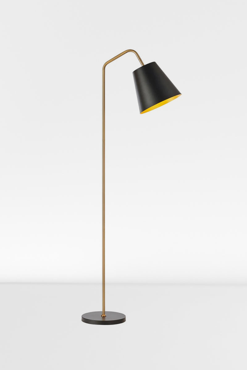 Mid century modern floor lamp with a matt black shade and base and a brushed gold stem.