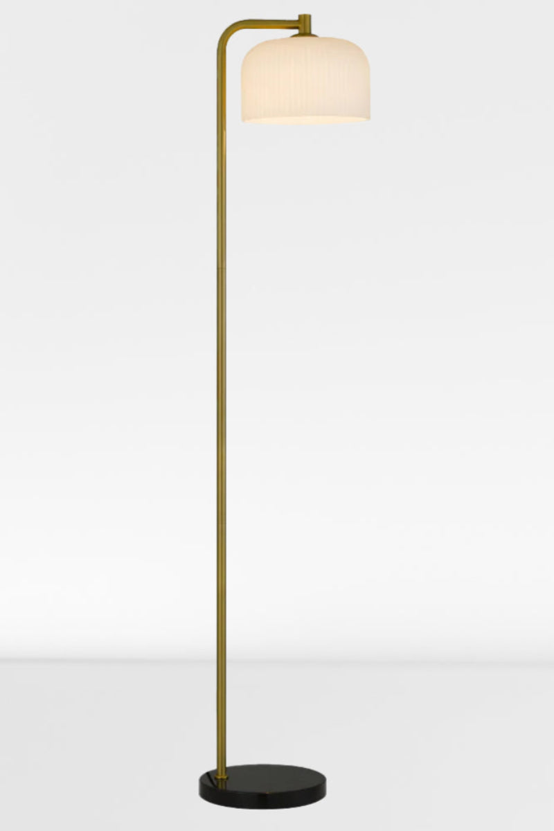 Floor lamp with a black marble base, iron body with an antique gold finish and a glass she with an opal ribbed finish 