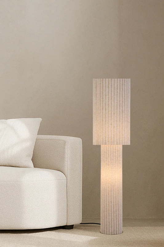 Textured fabric floor lamp in a beige in a neutral palette lounge room. 