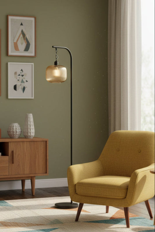 Amber reeded glass shade on a black suspended floor lamp. 