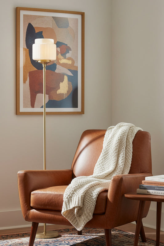 a subtle Art Deco aesthetic. Its opal glass shade features tiered geometric detailing and crisp lines