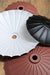 large and small umbrella shades in black and rust finish