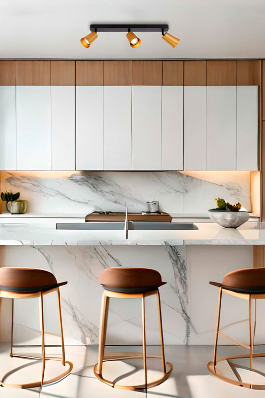 spotlights in gold finish with 3 lights over kitchen island