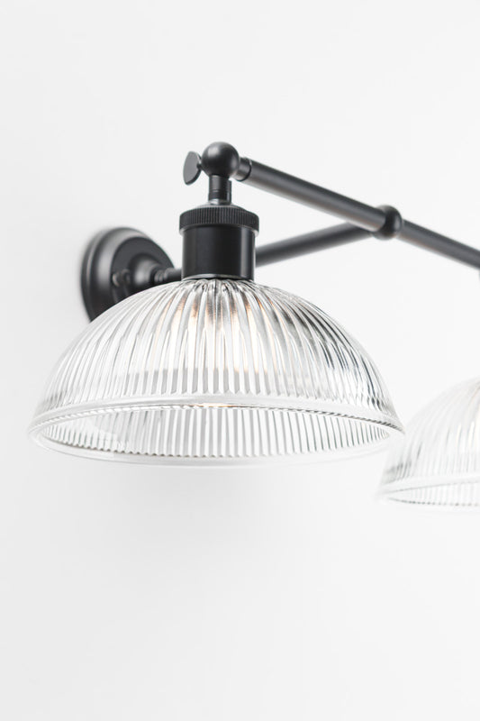 dome shaped glass shade has visible raised ridges running across its surface, creating a textured appearance.