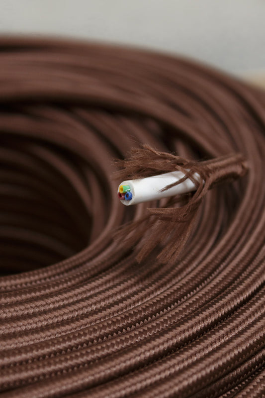 Close up of the Dark brown textile cloth cord showcasing 3 cord insulation. 