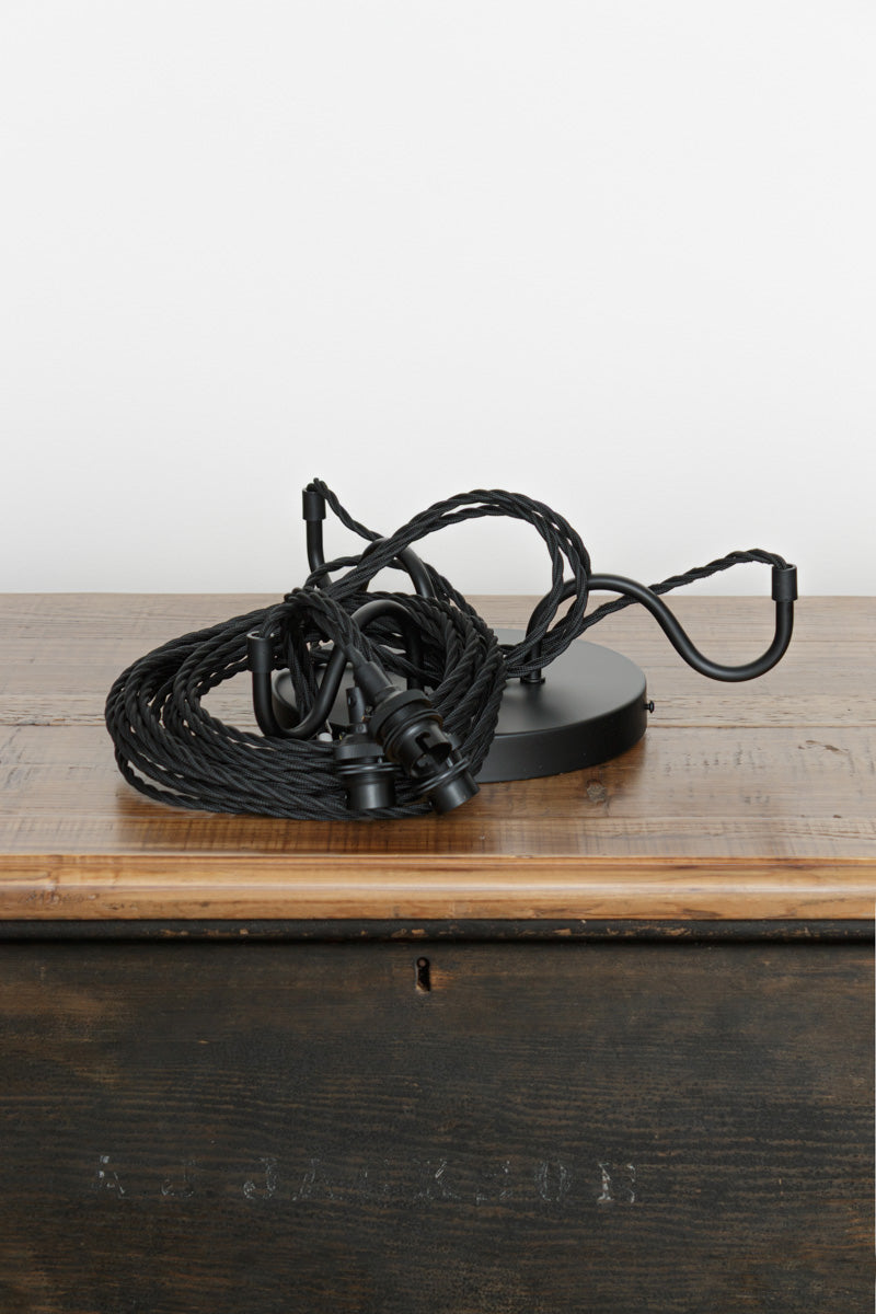 Unique goosneck pendant cord. three steel goosneck cord grips. black twist cloth cord