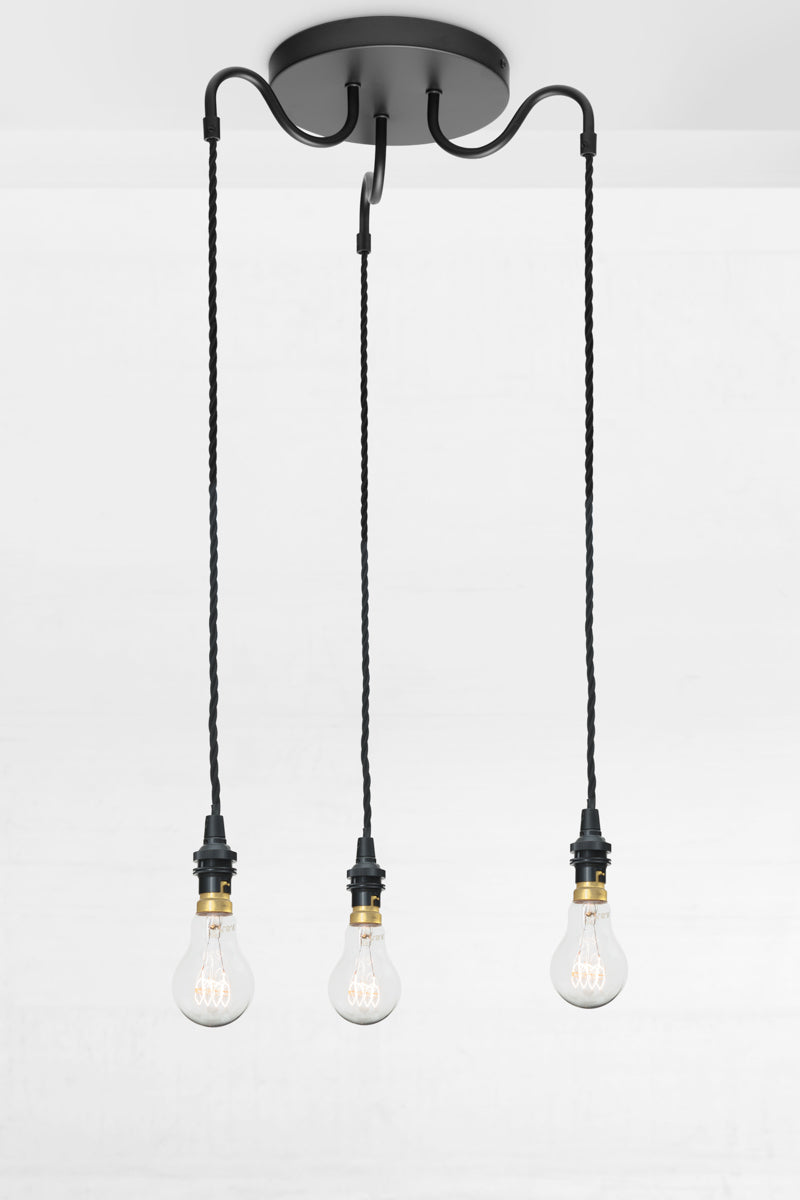 3 arm goossneck drop pendant lighting with black twisted pendant cords, paired with clear bulbs