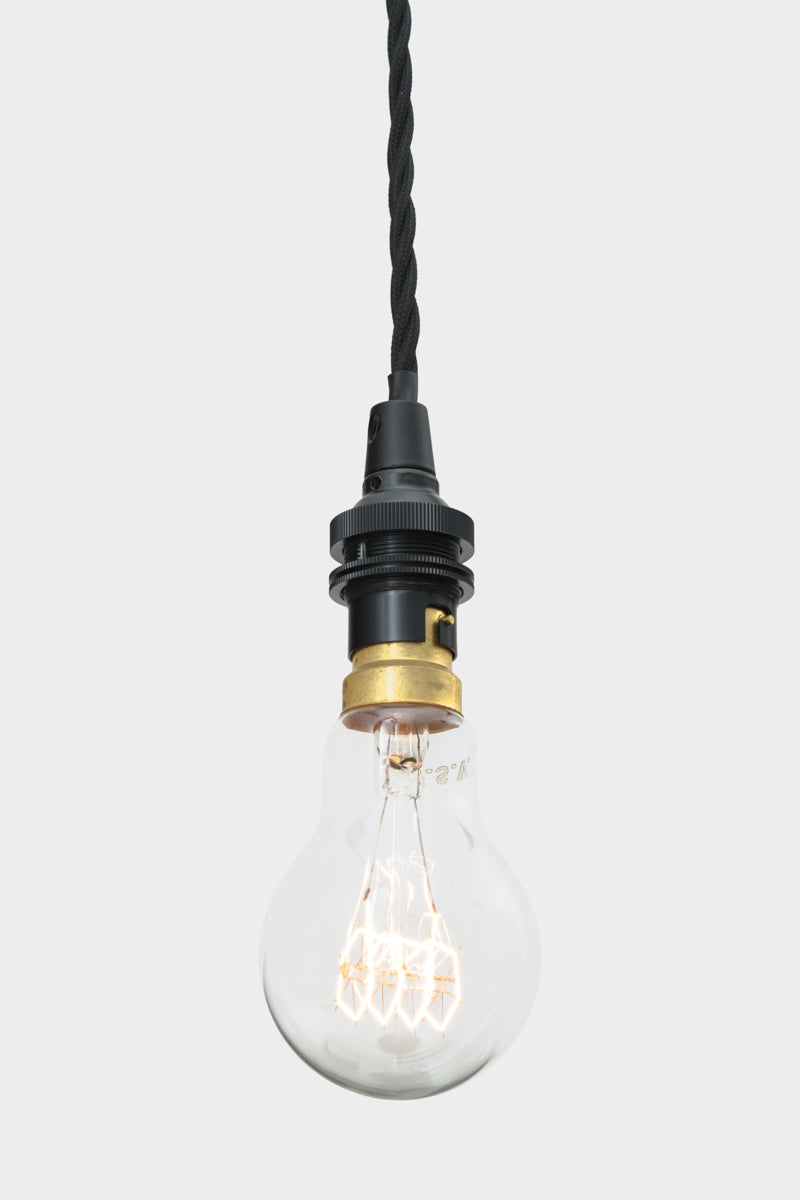 Close up of the black braided twist cord and lamp holders of the multi drop gooseneck pendant. 