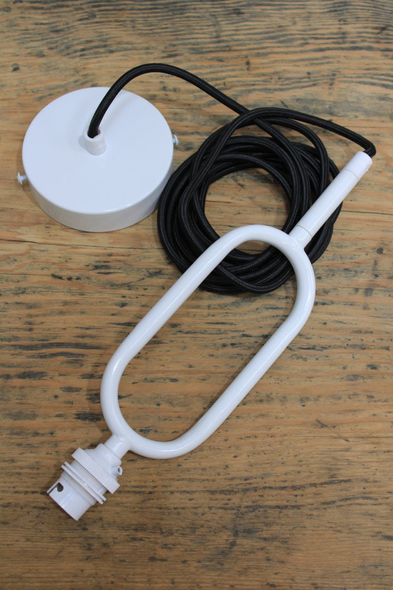 Loop pendant cord in white finishes. 