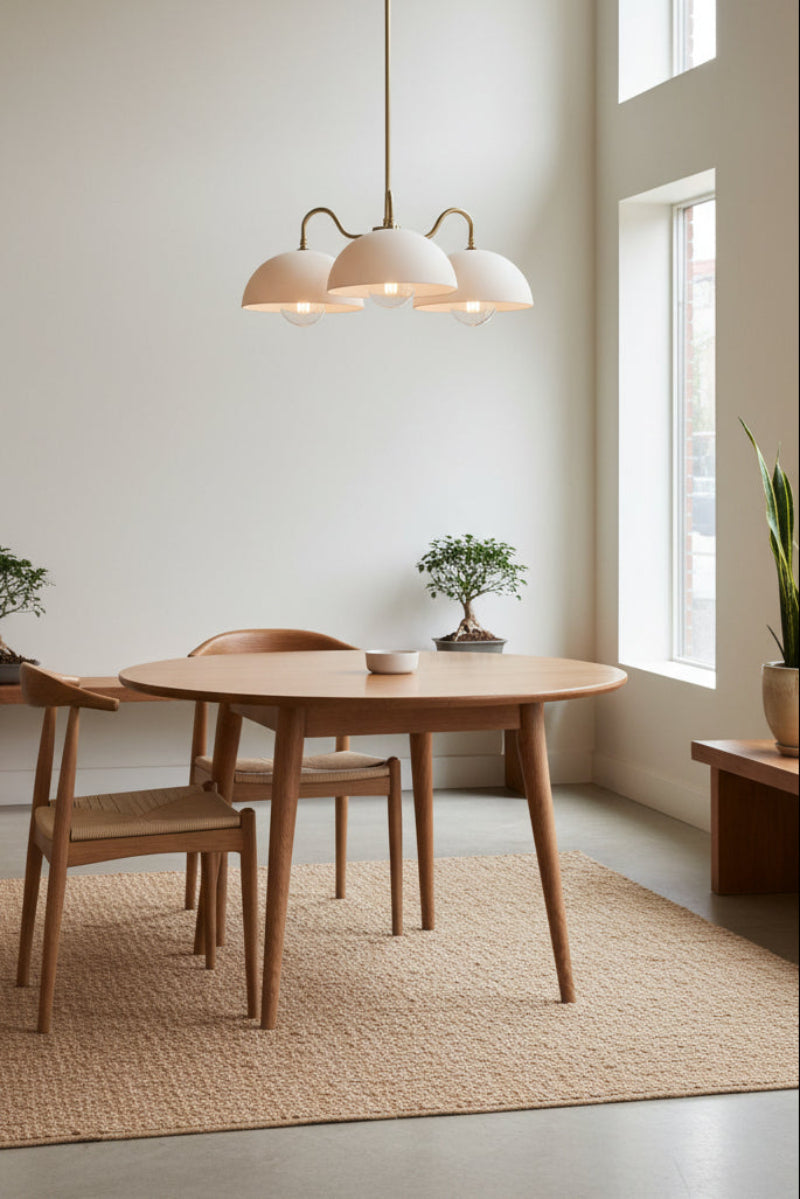 3 light pendant light over round dining table in relaxing decor
