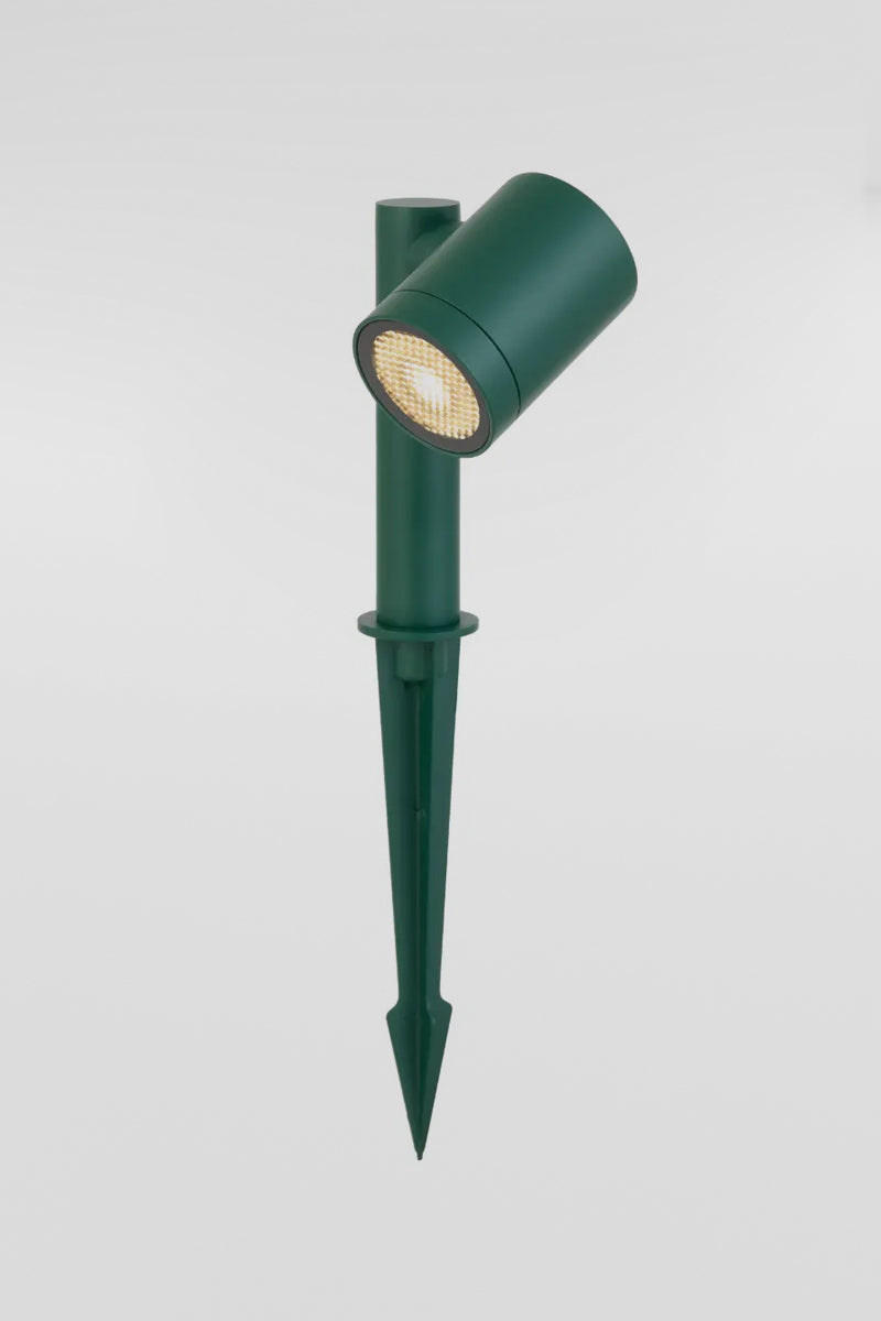 Green garden spike light with an adjustable spotlight head and ground spike, lit on a plain grey background