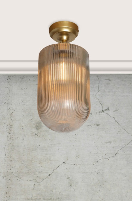 clear reeded glass shade with gold ceiling rose