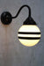 Hand painted opal glass ball pendant light with two stripes on black steel sconce. 