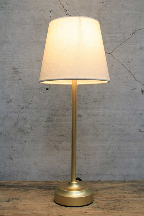 Gold table lamp with white fabric shade