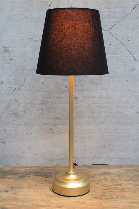 Gold table lamp with black fabric shade