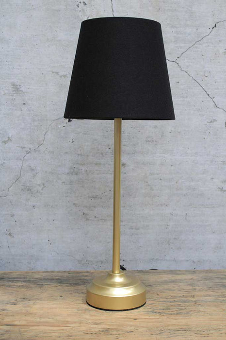 Gold table lamp with black fabric shade off