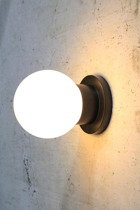 Bunker globe wall light with opal glass ball cover