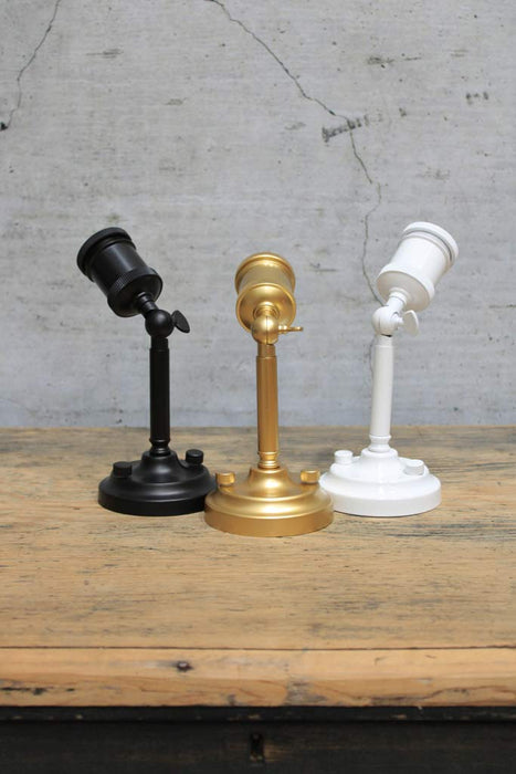 Black, white and gold/brass finish wall lights