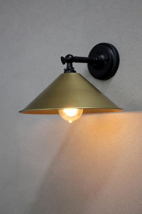Small brass cone wall light with black arm