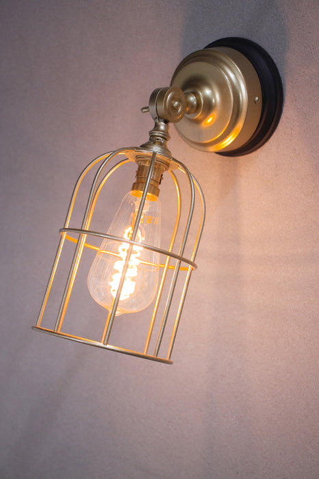 Gold cage wall light with small shade