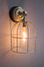 Gold cage wall light with large shade