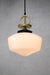 Medium opal glass pendant light with gold brass disc cord with black gallery