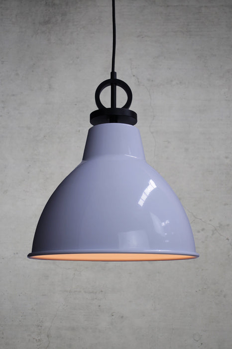 White pendant light with black cord with disc