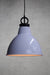White pendant light with black cord with disc