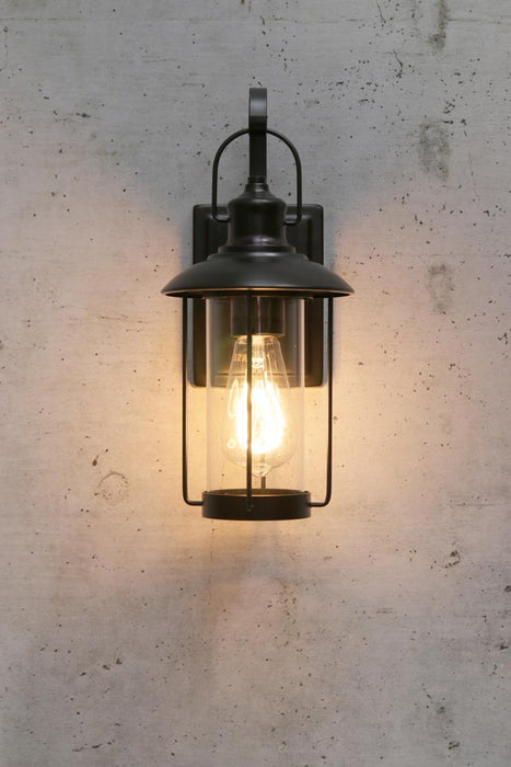 Outdoor wall light with classic lantern design . 