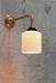 Portofino Ribbed Ceramic 90 Degree Wall Light in gold/brass.