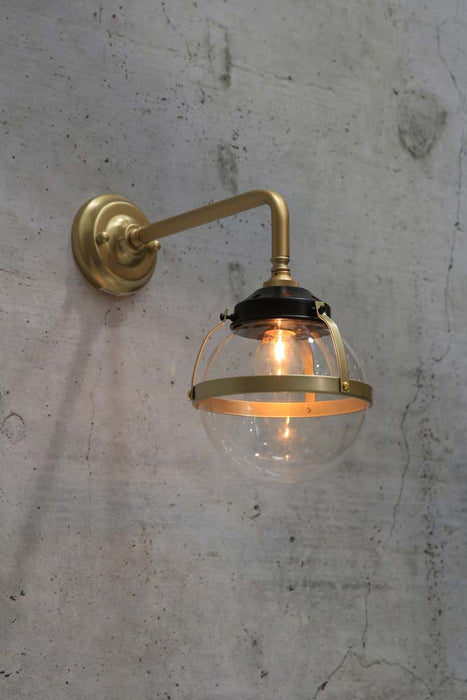 Huxley wall light with gold/brass 90 degree arm and small clear shade
