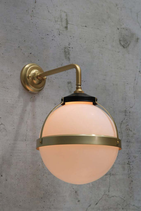 Huxley wall light with gold 90 degree arm and medium opal shade