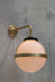 Huxley wall light with gold 90 degree arm and medium opal shade