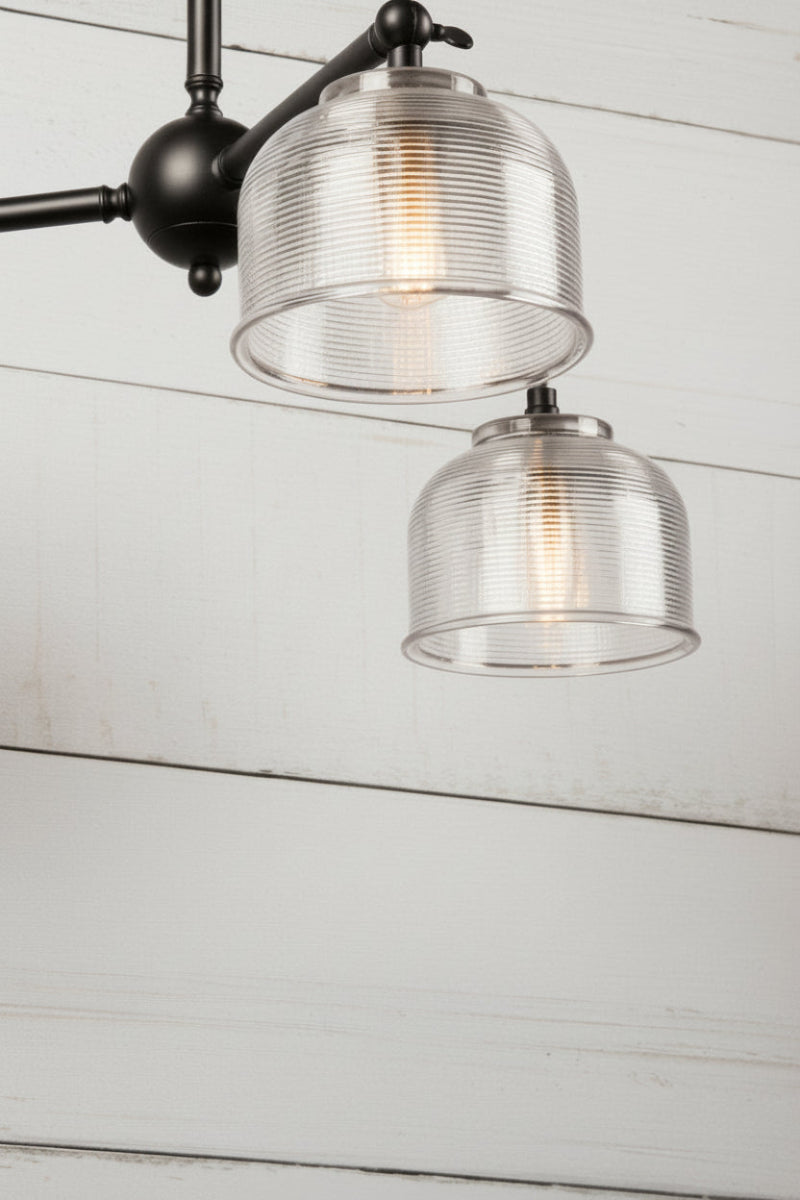 Steel triple arm flush mount in black with clear shades