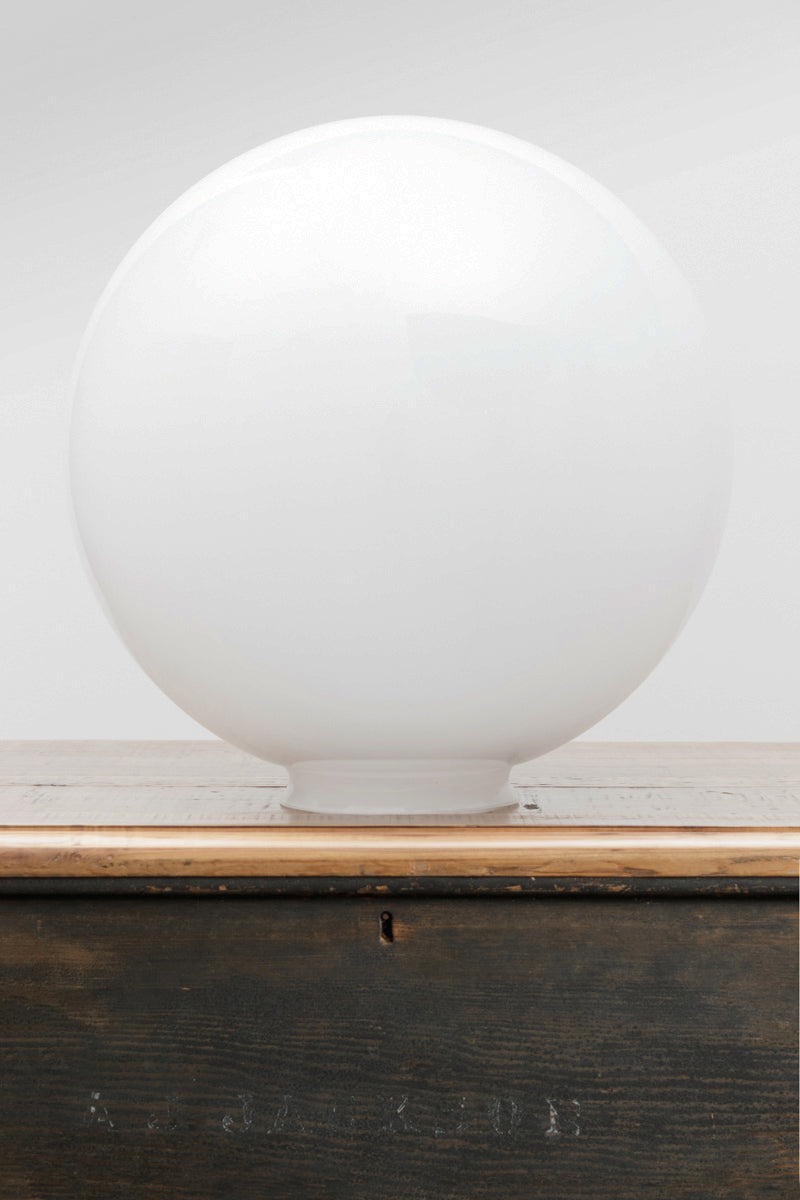 Extra Large opal glass ball shade on a timber bench. 
