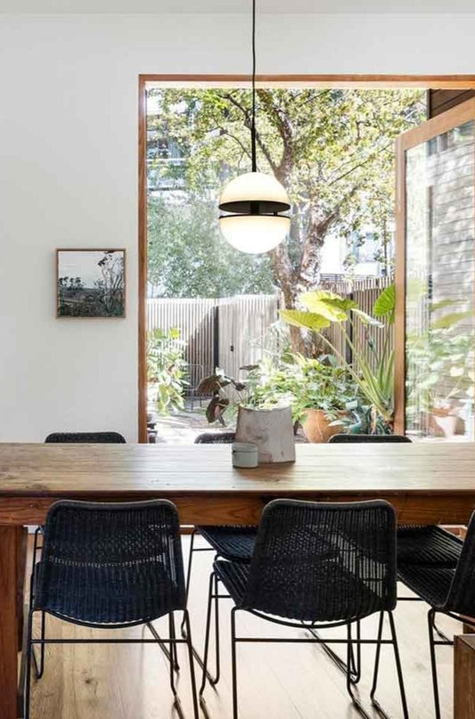 led light in two halves over dining table.
