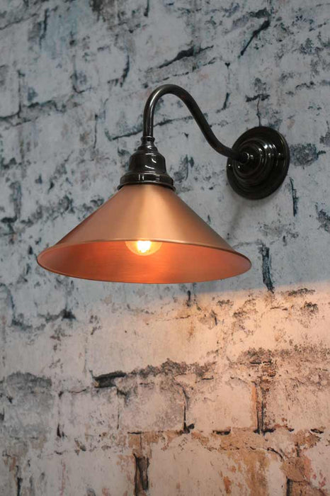 Outdoor-wall-light-with-bright-copper-shade-and-bronze-arm