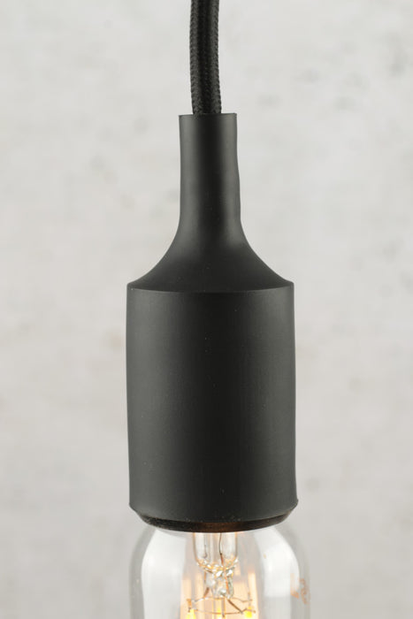 close up of black bare bulb pendant light